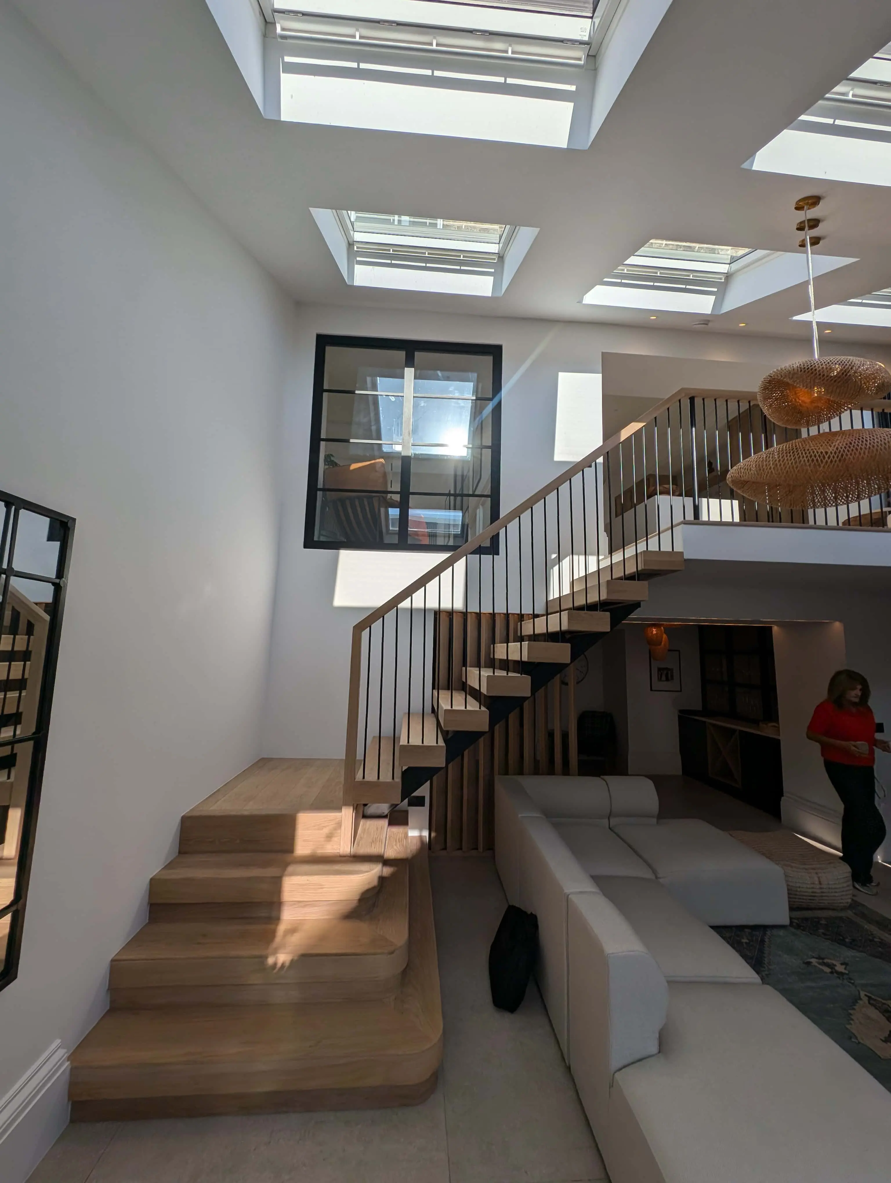 carlton-terrace-double-height-staircase-skylights-acre-design.webp Double-height living space with bespoke oak and steel staircase and rooflights in Carlton Terrace townhouse renovation by Acre Design