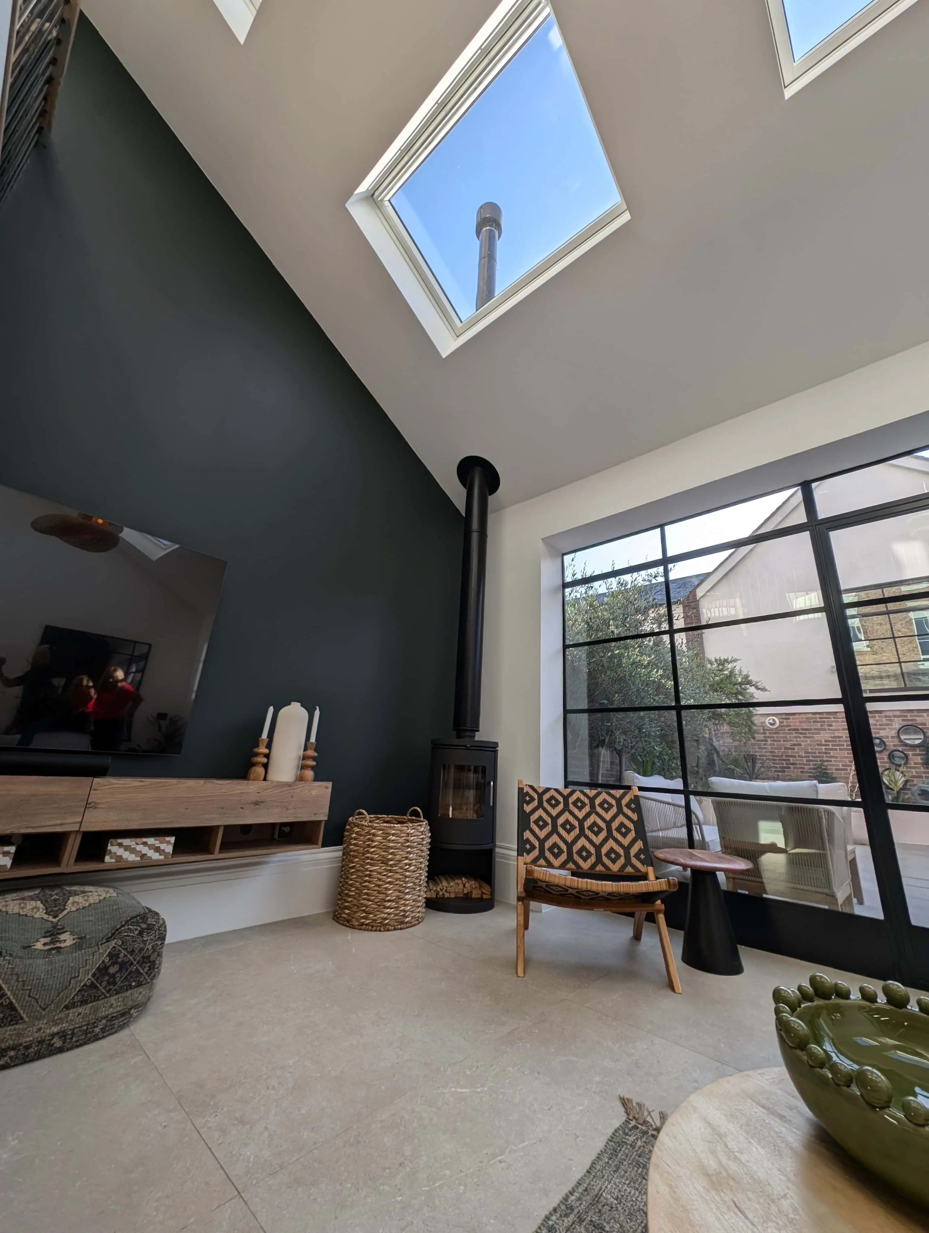 carlton-terrace-garden-room-critall-doors-skylights-acre-design.webp Contemporary garden room with Critall-style doors, skylights and wood-burning stove in Carlton Terrace townhouse renovation