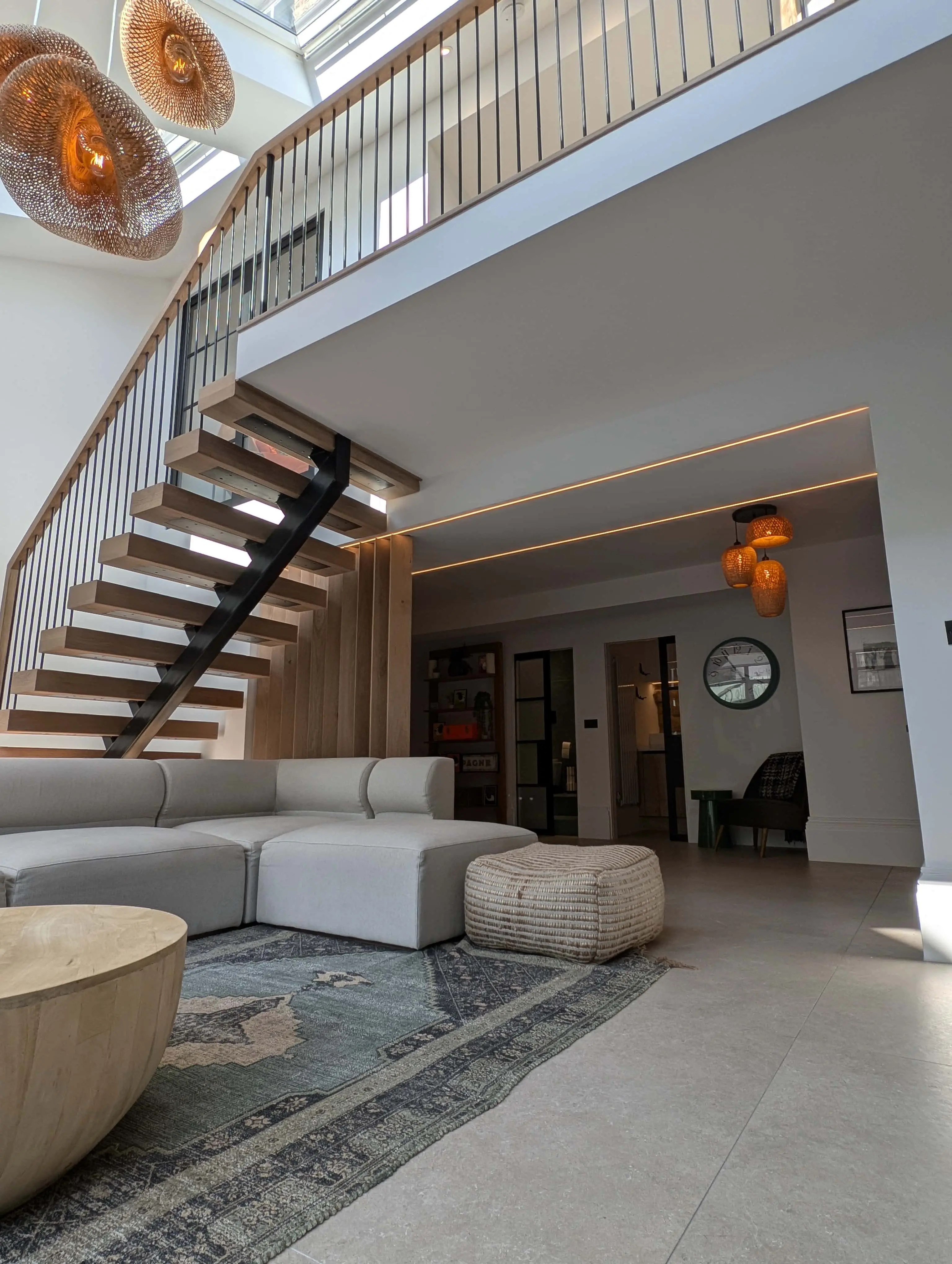 carlton-terrace-double-height-living-space-oak-staircase-acre-design.webp Double-height living area with bespoke oak and steel staircase in Carlton Terrace townhouse renovation by Acre Design