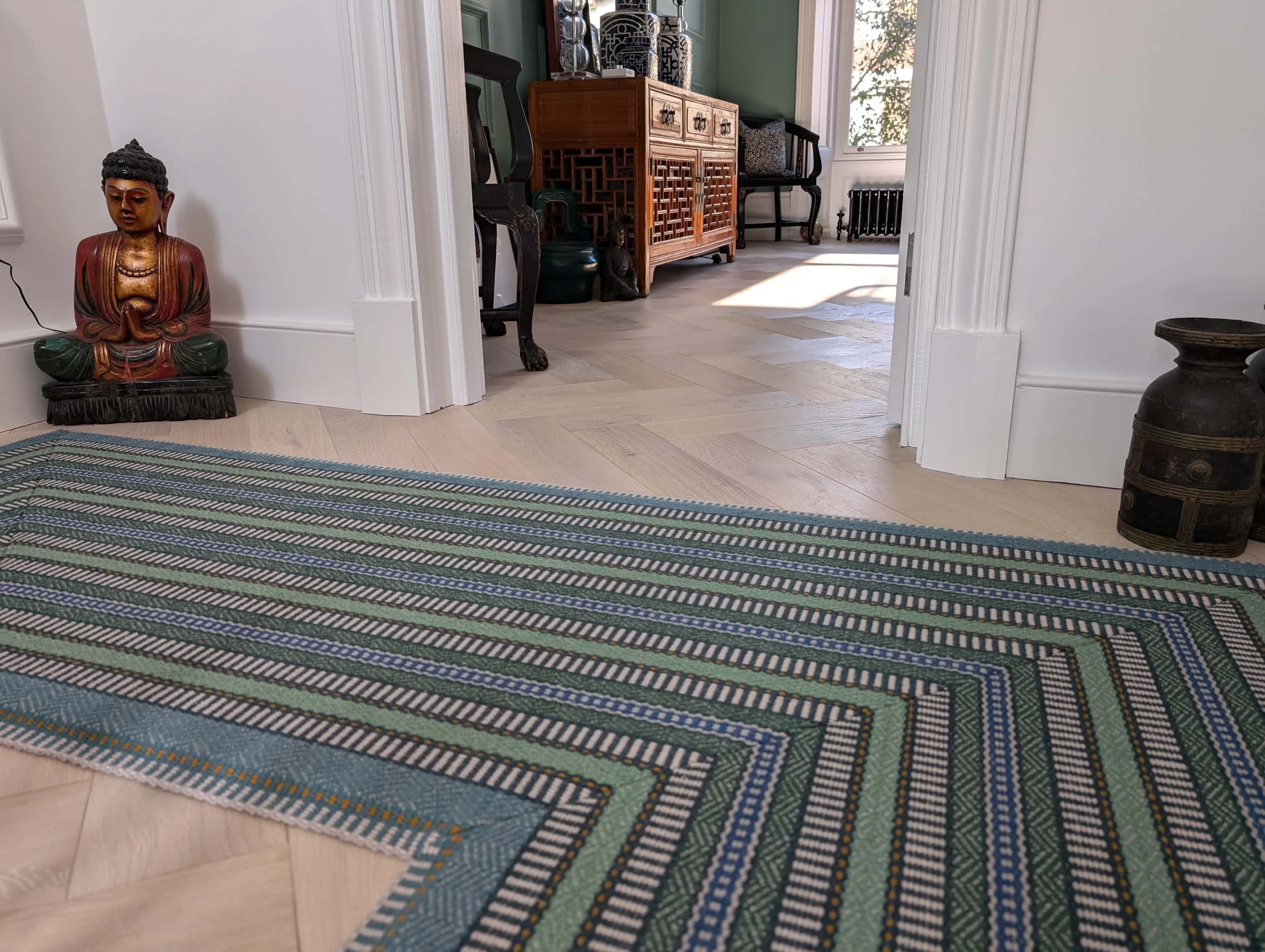 carlton-terrace-heritage-hallway-herringbone-flooring-acre-design.webp Heritage townhouse hallway with herringbone oak flooring and period detailing at Carlton Terrace renovation