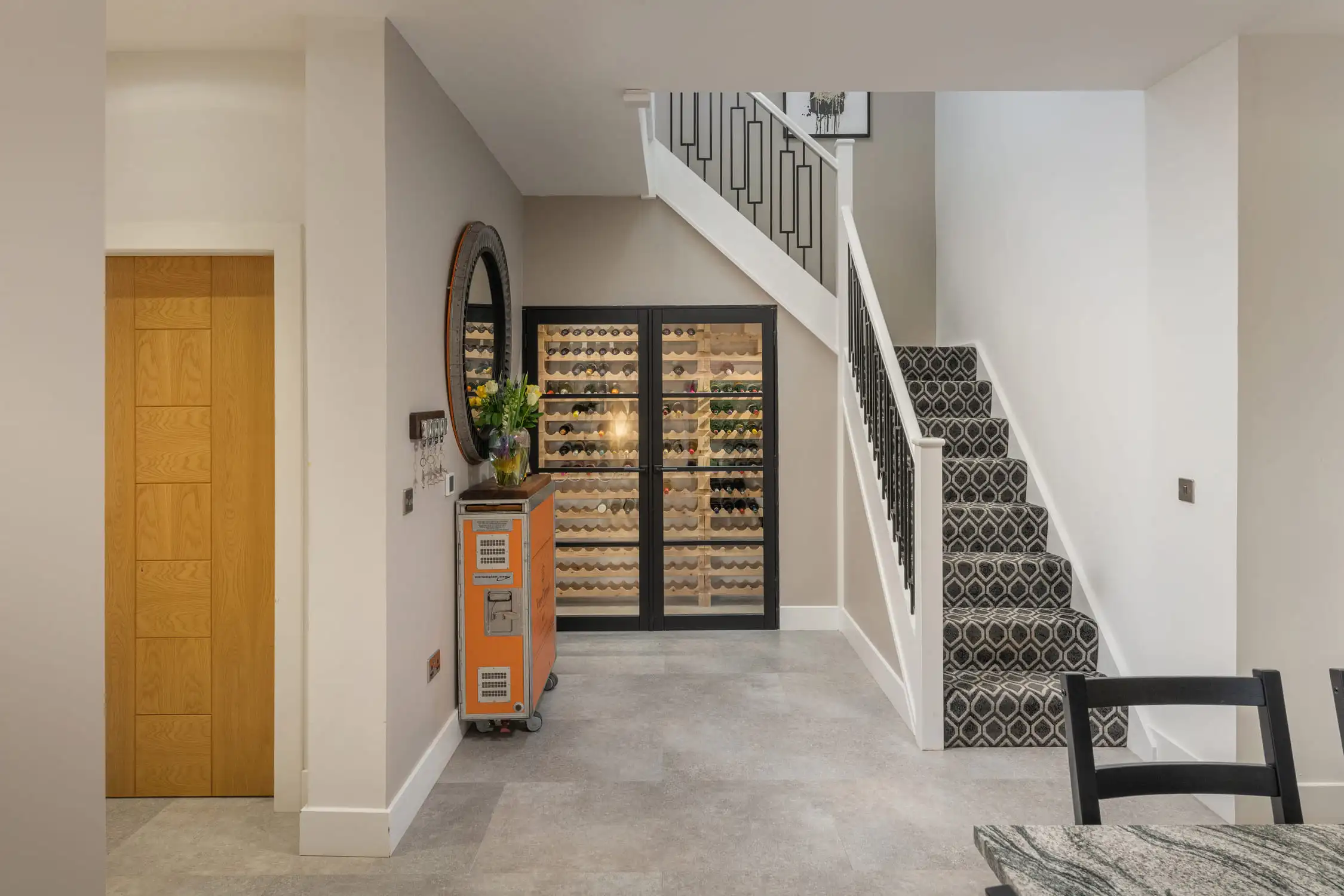 Hazelwood-Road-Great-Park-Gosforth-Newcastle-Self-Build-Home-Design-Acre-open-plan-hallway-modern-stairs-luxury A large and spacious entrance hallway to this new build home features oriental sideboard and calm, white décor. Large self build home designed by Acre Design Newcastle on Hazelwood Road, Great Park.