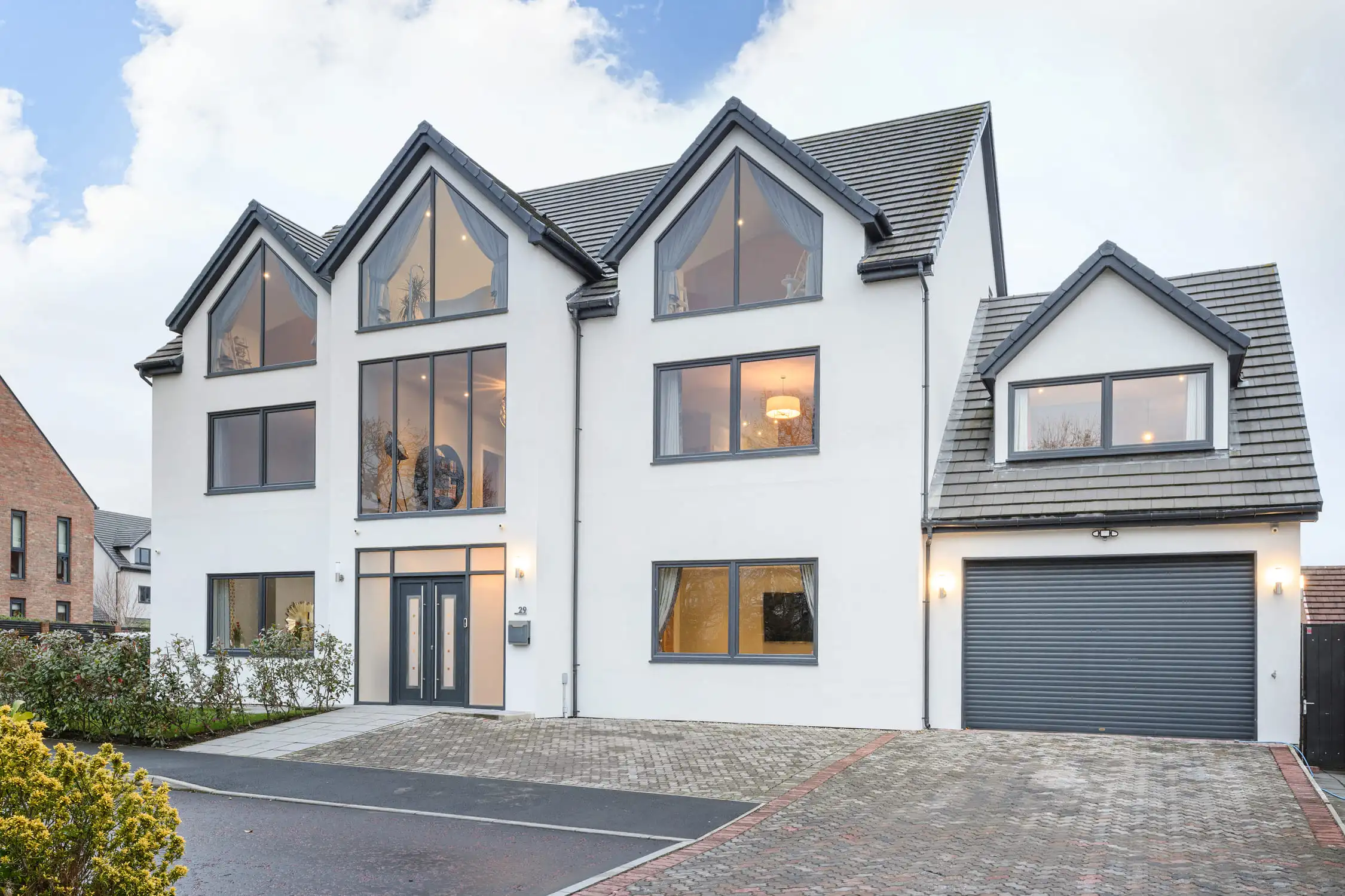 Hazelwood-Road-Great-Park-Gosforth-Newcastle-home-design-external-view-by-day-Acre-Design-architectural-design This if the front view of this self build home we designed in Great Park, Newcastle upon Tyne. The home was designed with symmetry in mind and this looks stunning here. Large self build home designed by Acre Design Newcastle on Hazelwood Road, Great Park.