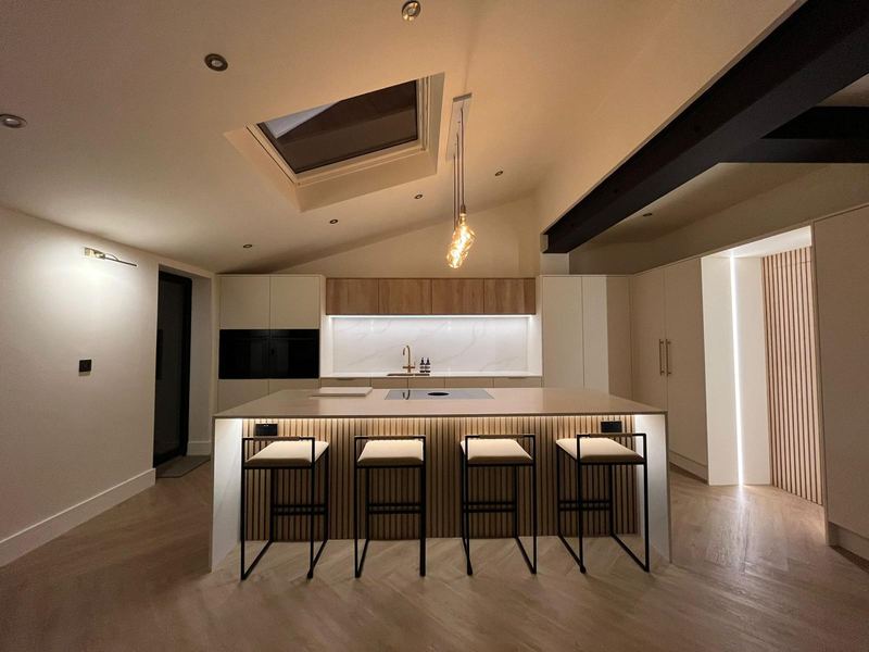 Open-plan kitchen extension in Sunderland with an exposed steel beam and roof glazing