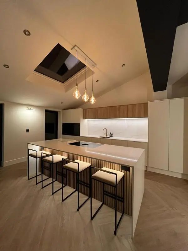 The same Sunderland home after the work, with a new open-plan kitchen, island seating and a rooflight