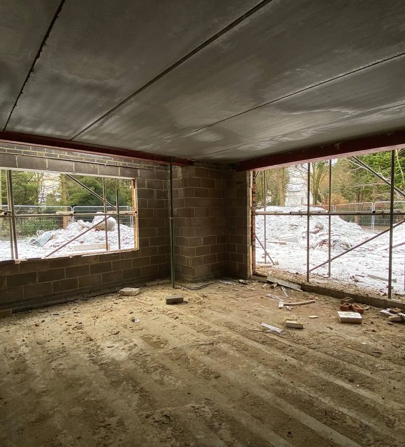 Construction in progress inside a new home in Woolsington, Newcastle, with blockwork walls and window openings