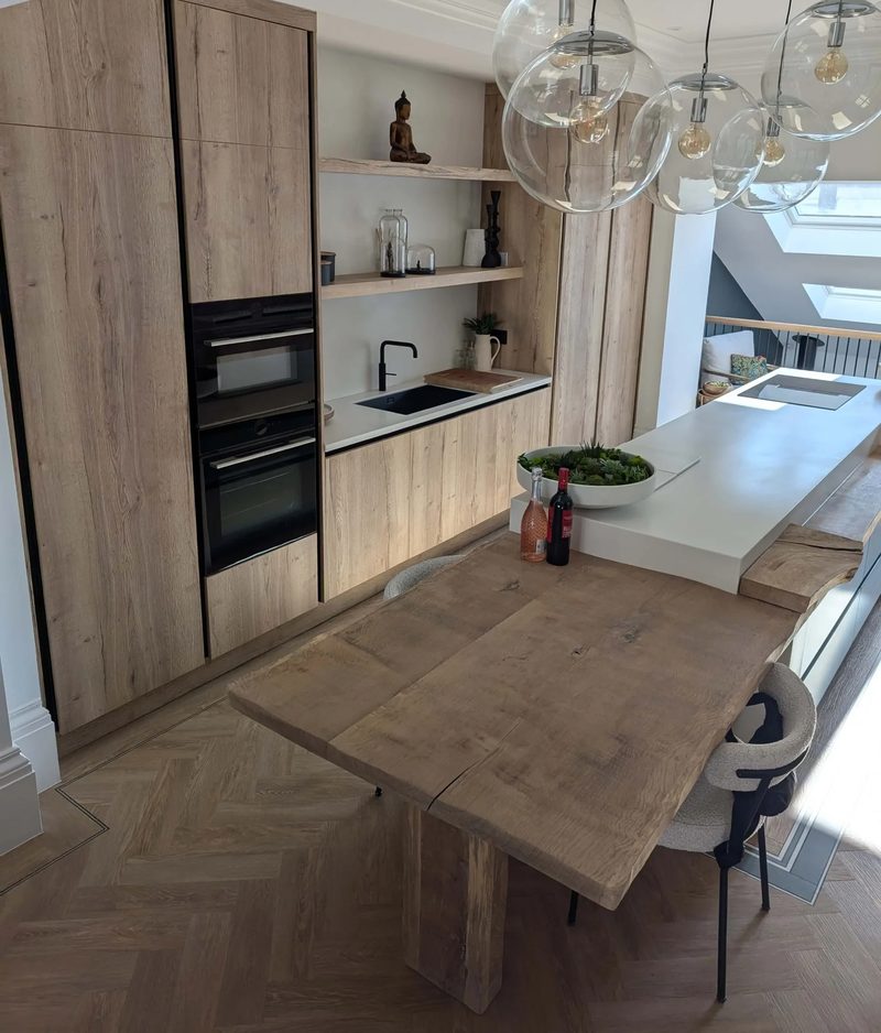 Bespoke oak kitchen with integrated shelving and an island in a renovated period home in Newcastle